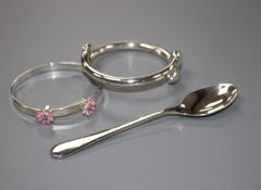 A modern silver coffee spoon and two 925 child's bangles, gross weight 31 grams.