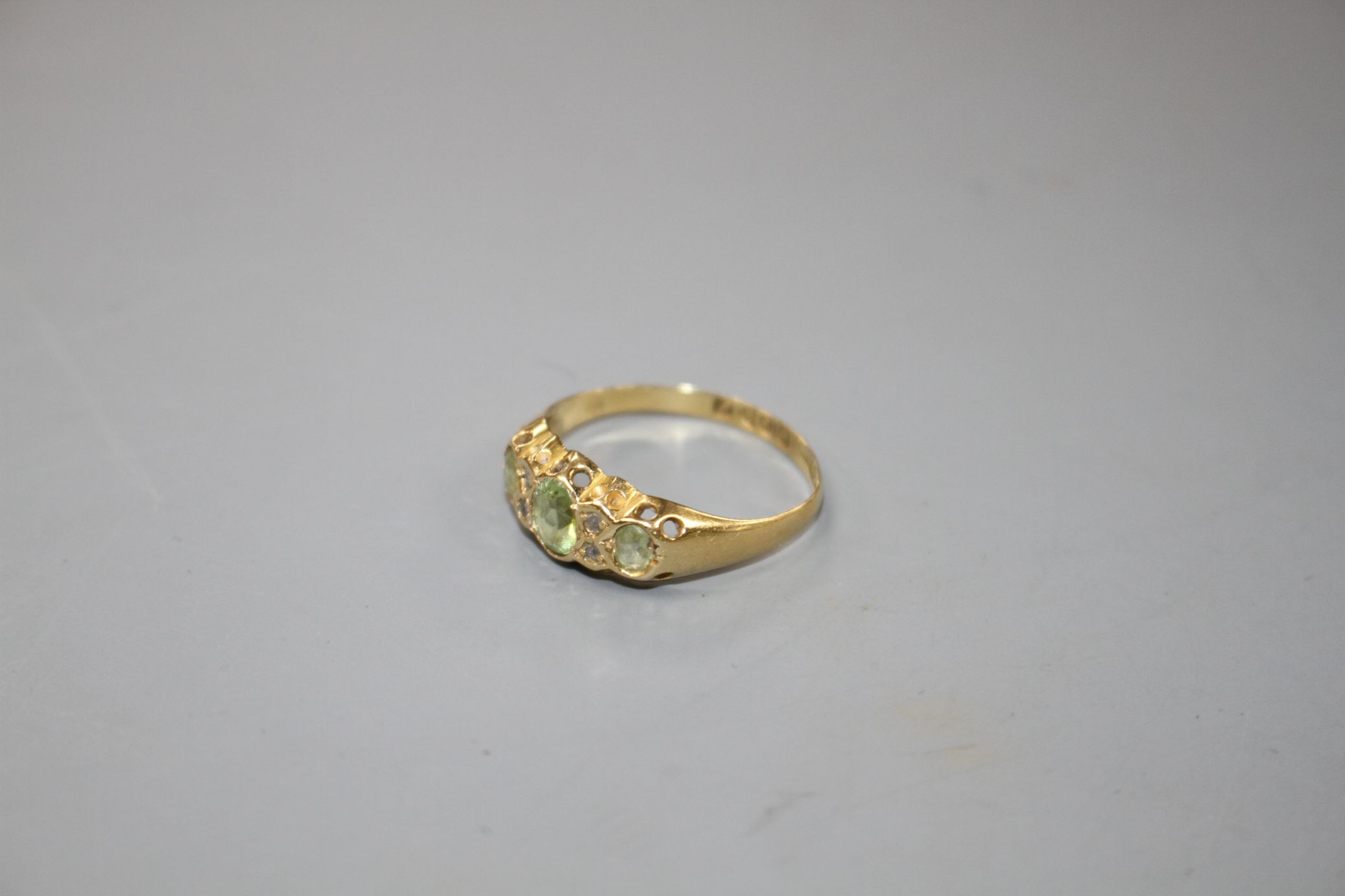 An early 20th century 18ct gold, green tourmaline and diamond chip set half hoop ring, size R, gross - Image 2 of 4