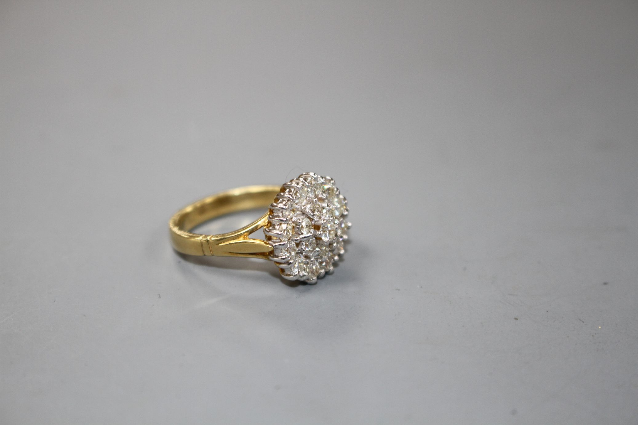 A modern 18ct gold and diamond cluster dress ring, size M, gross 7.8 grams.Condition- Two of the - Image 2 of 4