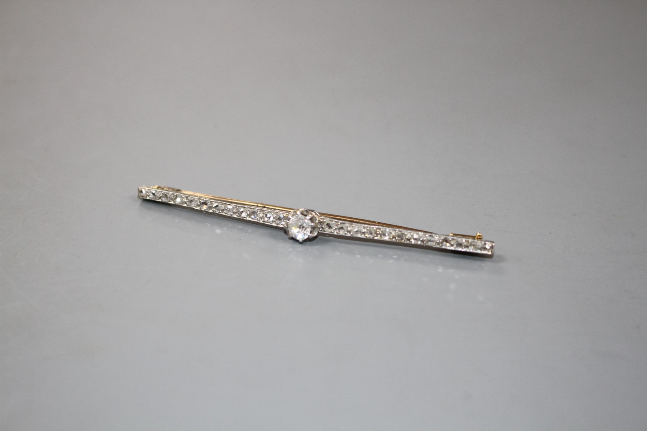 A 1920's yellow and white metal, diamond bar brooch, with central old cut diamond and millegrain set - Image 3 of 4