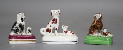 Three small Staffordshire porcelain groups of a King Charles Spaniel and puppy, c.1835-50, all