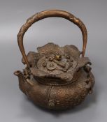 A Chinese iron teapot and cover, height 16cm Condition: Construction flaw to the handle showing as a
