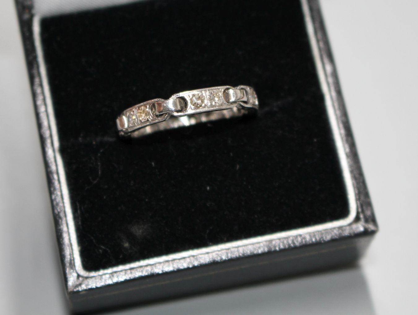 An unusual white metal (stamped Plat) and twelve stone diamond set eternity ring, with six 'chain' - Image 6 of 6