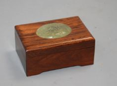 A Chinese hardwood box with inset bowenite jade panel, crack to wood on lid, otherwise in good