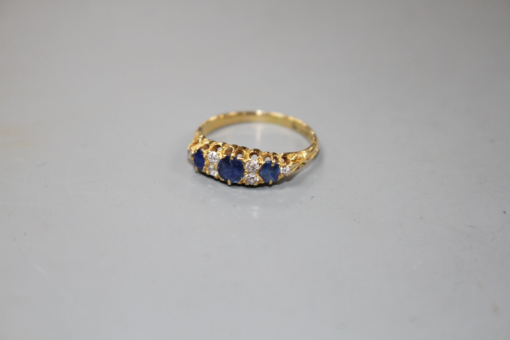 A George V 18ct gold, three stone sapphire and six stone diamond set half hoop ring, size M, gross - Image 2 of 5