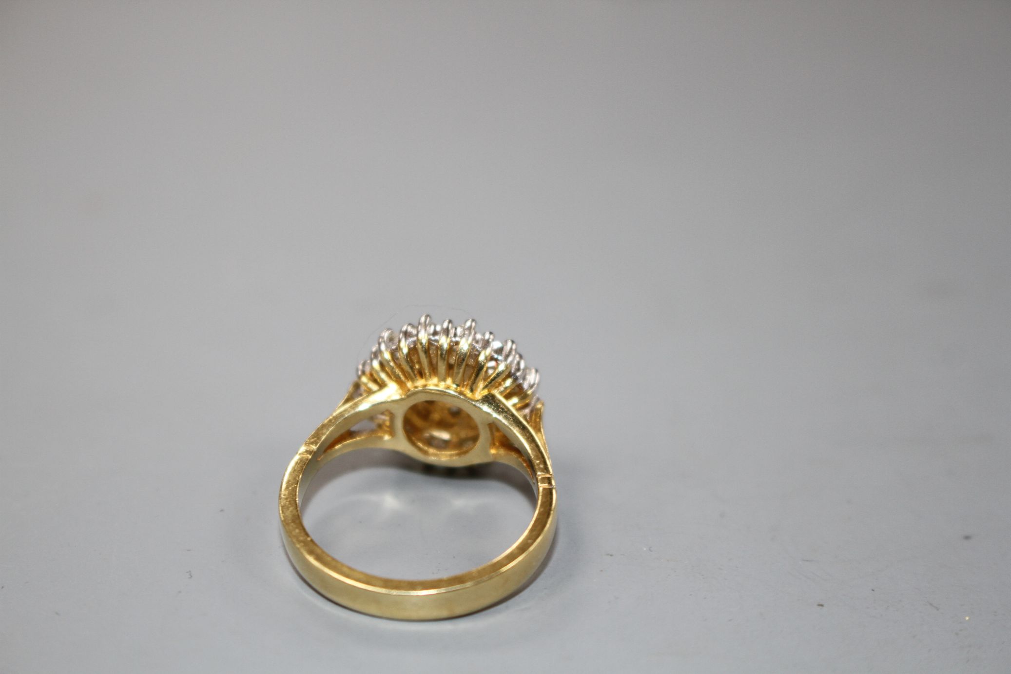 A modern 18ct gold and diamond cluster dress ring, size M, gross 7.8 grams.Condition- Two of the - Image 4 of 4