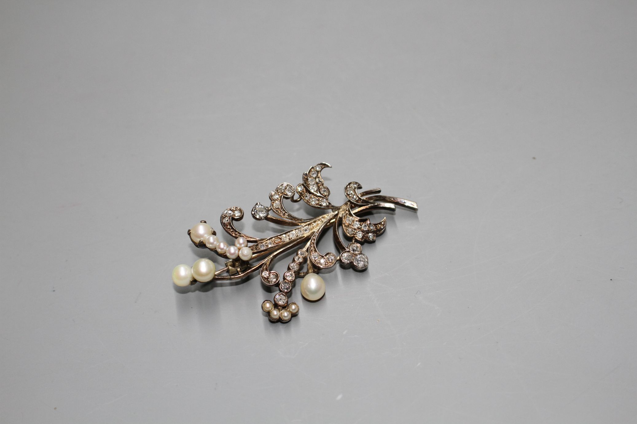 An early-mid 20th century yellow metal, cultured pearl and diamond set floral spray brooch, 62mm, - Image 3 of 3