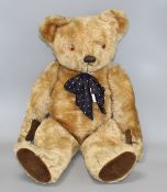 A 1950's Chad Valley bear, 26in., arm label, velvet pads