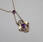 An Edwardian 9ct, amethyst and seed pearl set pendant necklace, pendant lower section 25mm.