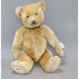 A Chiltern Hugmee bear c.1930's, 19in., blond mohair, good condition, glass eyes and velvet pads