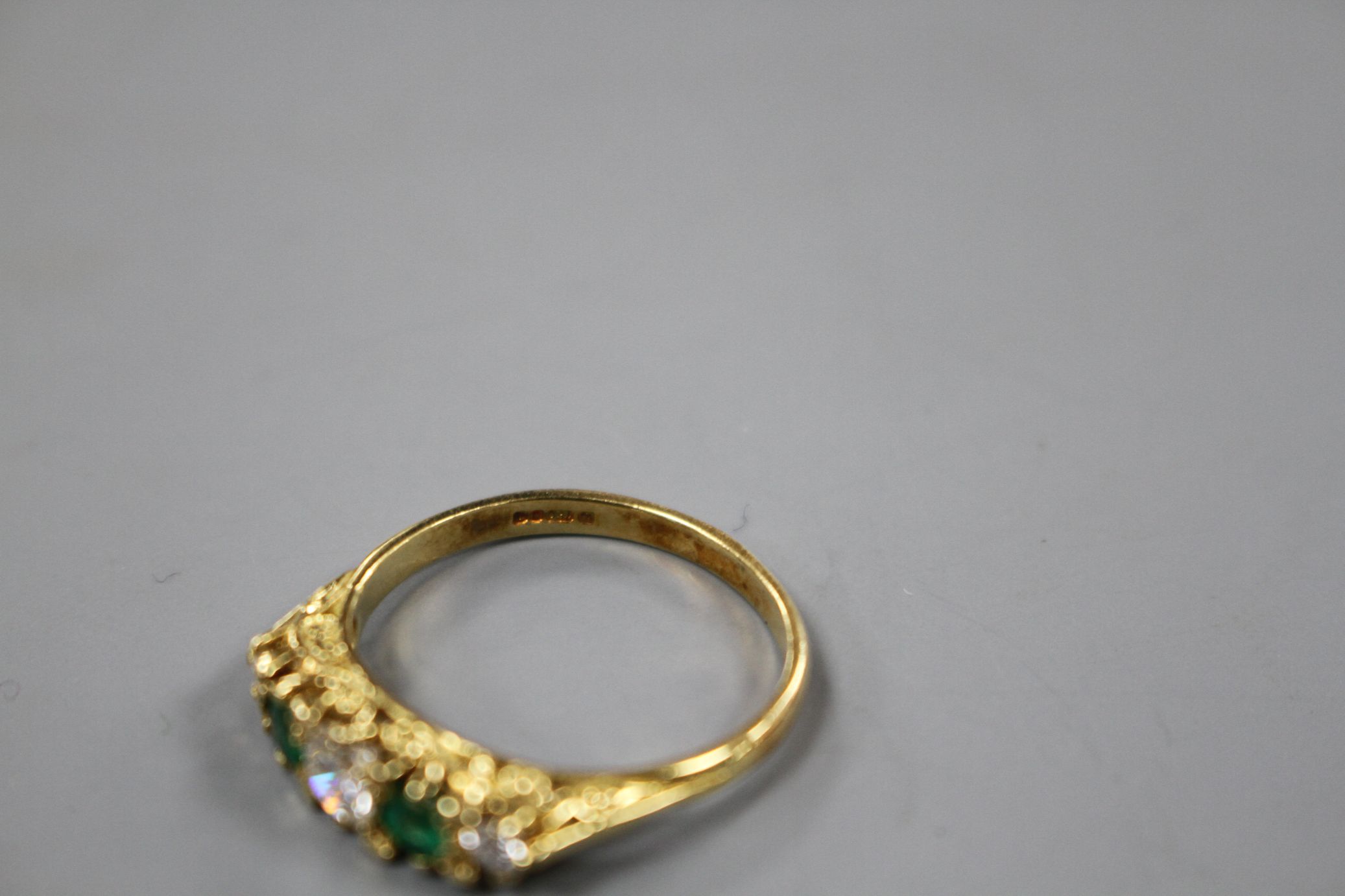 A modern Victorian style 18ct gold, two stone emerald and three stone diamond set half hoop ring, - Image 5 of 5