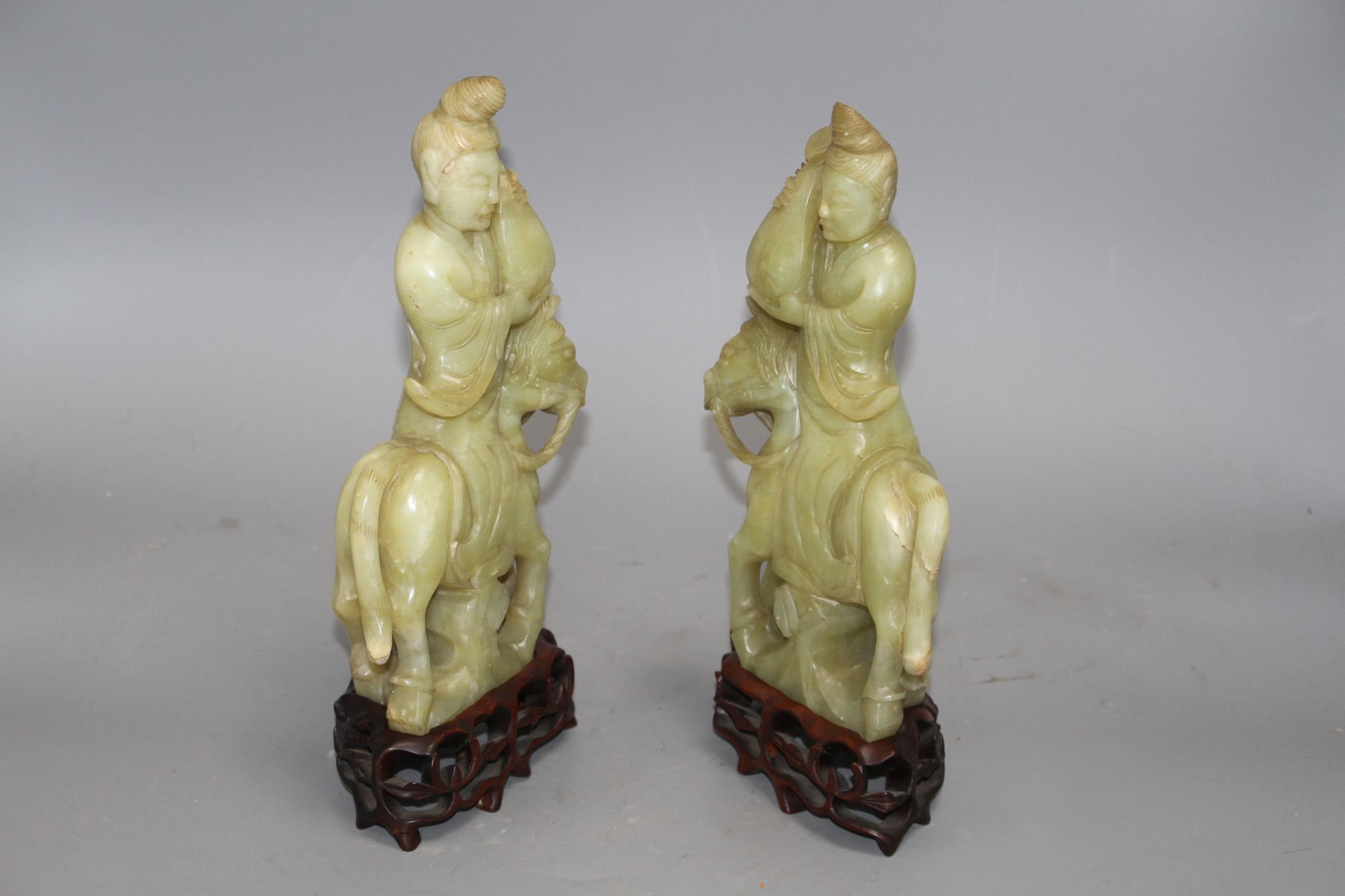 A pair of Chinese bowenite jade groups of a lady riding a horse, wood stands natural inclusions - Image 4 of 9