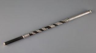 A Chinese hardwood and silver overlaid baton, 19th century, the shaft entwined by a dragon, with two