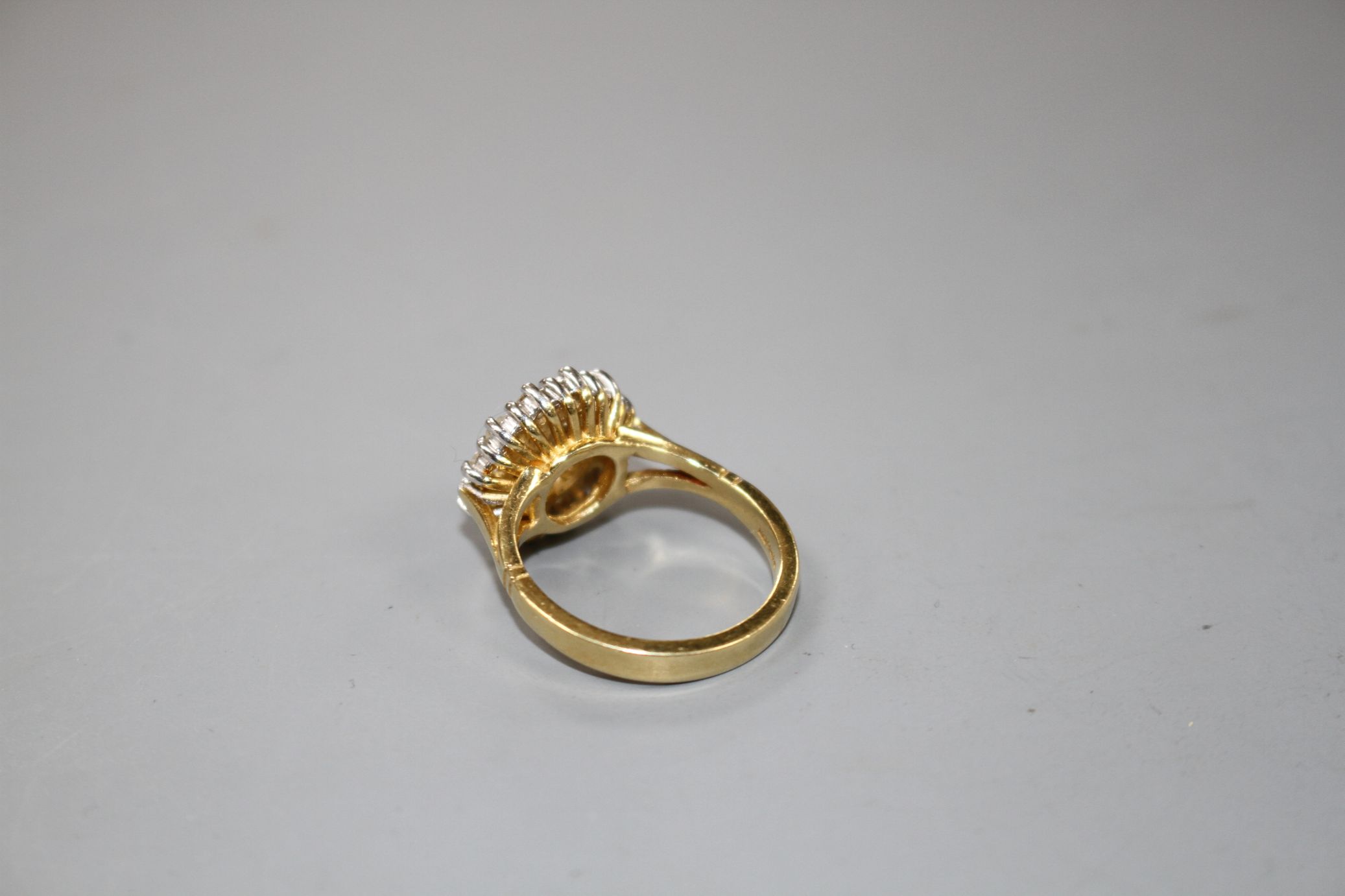 A modern 18ct gold and diamond cluster dress ring, size M, gross 7.8 grams.Condition- Two of the - Image 3 of 4