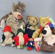 A Baloo pyjama case, a Schoolboy Scout Gromet, a Gund Winnie The Pooh, three small Paddingtons and a