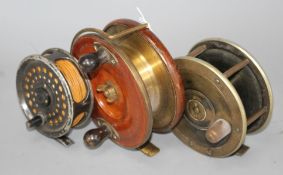 Three vintage fishing reels Condition:- brass mounted mahogany reel stamped Patent 21873, initials