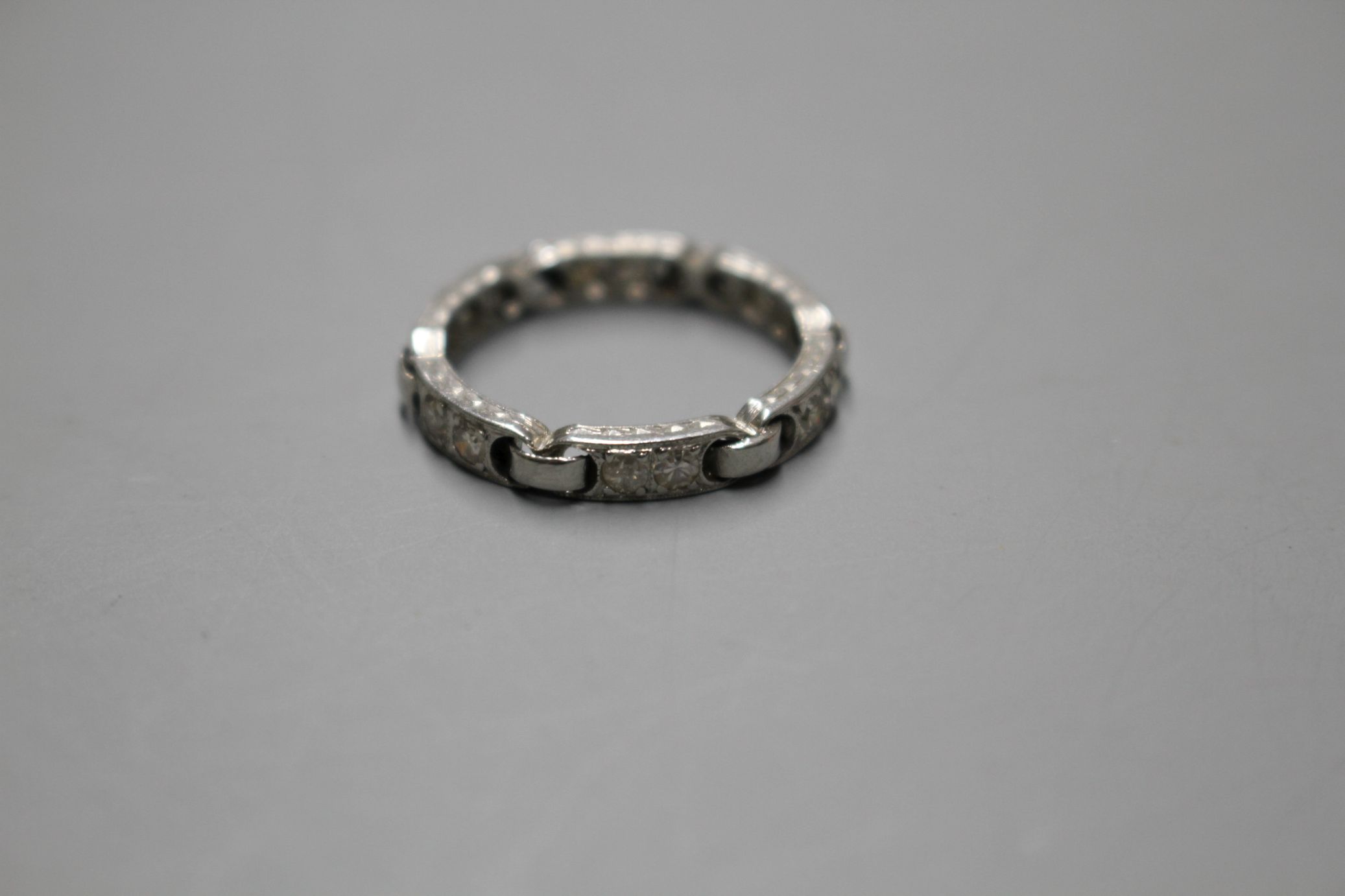 An unusual white metal (stamped Plat) and twelve stone diamond set eternity ring, with six 'chain' - Image 3 of 6