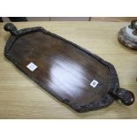 A Burmese carved hardwood tray, 70cm Condition: In good condition, minor scuffing to underside