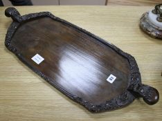 A Burmese carved hardwood tray, 70cm Condition: In good condition, minor scuffing to underside