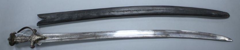An Indian sword tulwar, silver decorated iron Lahori hilt, blade with etched inscription, 18th