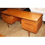 A 1950's G-Plan teak dressing table, fitted five drawers, W.152cm D.46cm H.70cm Condition: A