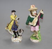 A 19th century Meissen figure of a huntsman and a 19th century English porcelain monkey band figure,