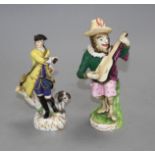 A 19th century Meissen figure of a huntsman and a 19th century English porcelain monkey band figure,