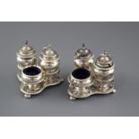 Two similar late 19th/early 20th century silver triform cruet stands by Horace Woodward & Co,
