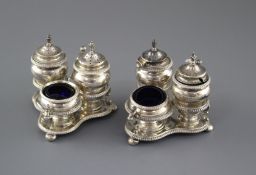 Two similar late 19th/early 20th century silver triform cruet stands by Horace Woodward & Co,