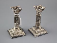 A pair of Edwardian silver corinthian column dwarf candlesticks by Williams Ltd, Birmingham, 1905,