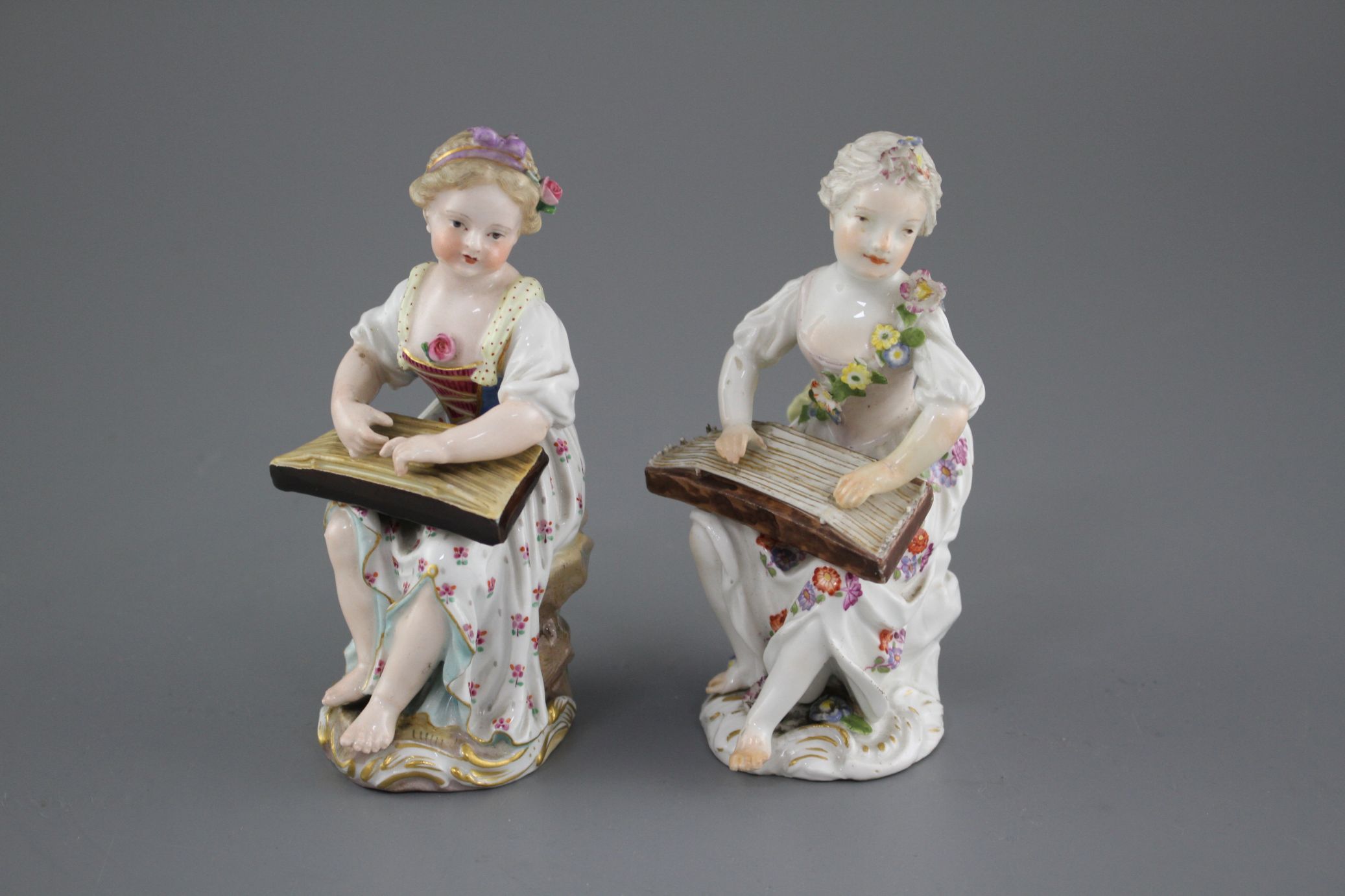 An 18th century Meissen figure of a girl playing a zither and a 19th century Meissen figure of a - Image 3 of 6