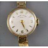 A lady's 1960's 9ct gold Fauve Leuba manual wind wristwatch, on a 9ct gold bricklink bracelet, gross