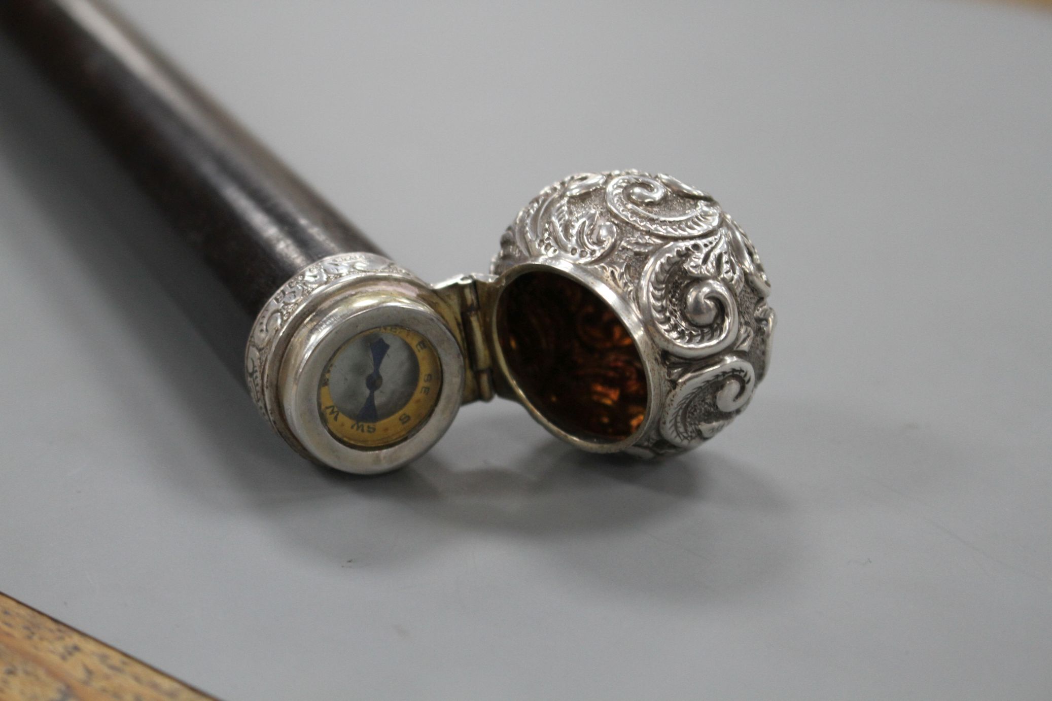 A Victorian walking stick with embossed silver pommel H.M., Birmingham 1906, opens to reveal a - Image 5 of 10