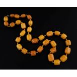A single strand barrel shaped amber bead necklace, gross weight 131 grams, 86cm.