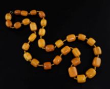 A single strand barrel shaped amber bead necklace, gross weight 131 grams, 86cm.