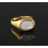 A 1970's 18ct gold, pave set diamond and black onyx set swivel head signet ring, size V, gross