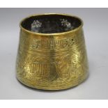 A Cairoware brass jardiniere, decorated with panels of figures and calligraphy, height 18cm,