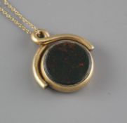 A late Victorian 9ct, bloodstone and carnelian set spinning fob, on an associated yellow metal