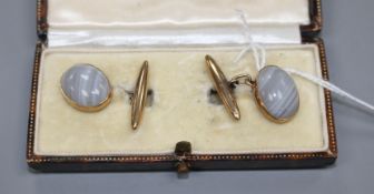 A pair of 9ct and cabochon grey banded agate set cufflinks, agate length 16mm, gross weight 7.7