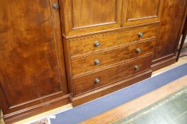 A Victorian mahogany breakfront wardrobe, W.288cm D.65cm H.230cm Condition: Overall of rich