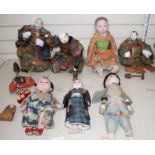 A collection of Japanese lacquered and composition head Gosha dolls, including three Musha