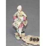 A Chelsea red anchor toy figure of a gallant gentleman, c.1755, 6.5cm Condition: Discoloured