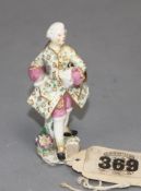A Chelsea red anchor toy figure of a gallant gentleman, c.1755, 6.5cm Condition: Discoloured