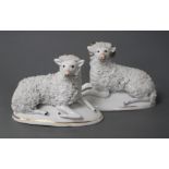 A good pair of Staffordshire porcelain figures of a recumbent ram and ewe, c.1830-50, each on an