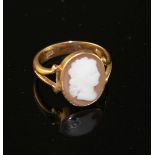 An early 20th century 18ct and oval cameo set dress ring, carved with the head of a lady to