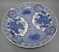 An Arita blue and white charger, 44.5cm Condition: Chip to rim