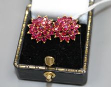 A pair of yellow metal and ruby cluster set flower head earrings, 13mm, gross weight 4.9 grams.