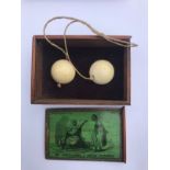 A John Jaques & Son game The Moffillisahn or Indian Castanets, in mahogany slide top box with