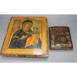 A 19th century Russian tempera on wood icon, 31 x 26cm and another smaller icon, 17.5 x 13cm