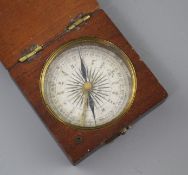 An early 19th century mahogany cased pocket compass, the dial marked in quadrants of ten degree